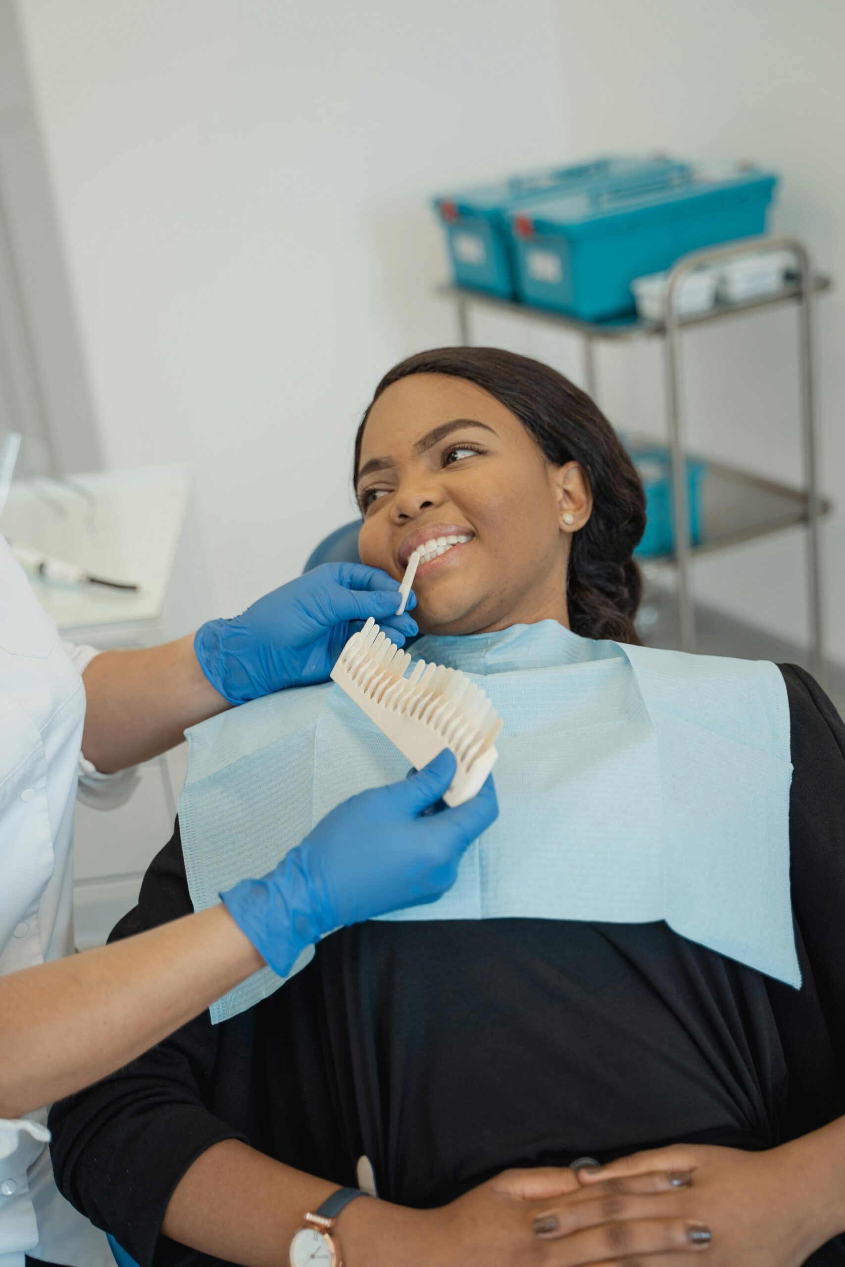 A patient receives dental care with a professional dentist in a clinic setting.